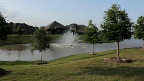 Tracking shot of Water Fall and Water Front Houses Stock Footage 91017330