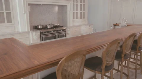 Tracking shot of a white large luxury kitchen Stock Footage 63499022