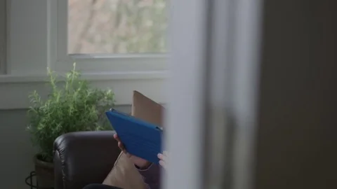 Tracking shot of young lady using a laptop Stock Footage 71326750