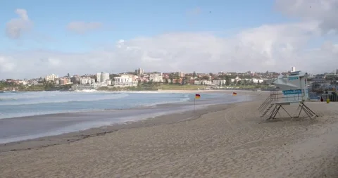 Tracking shots of Wild windy surf with big waves on an empty beach in Bondi  Stock Footage 137623797