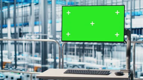 Tracking software displayed on green screen mockup monitor in smart factory Stock Footage 305483886