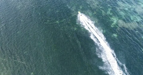 Tracking speed boat and wake in ocean by drone Stock Footage 81687404