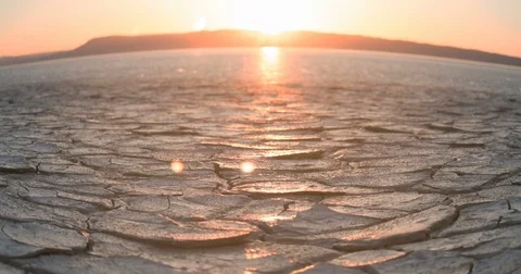 Tracking Sunrise Time Lapse across apocalyptic desert playa wasteland Fisheye 動画素材 77020421