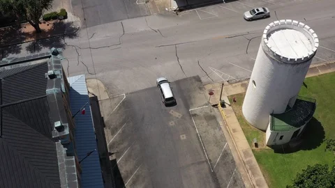 Tracking an SUV through downtown, Columbus, Texas, USA Video stock 129221646