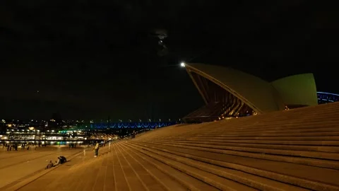 Tracking up Sydney Opera House steps and VIVID Harbour Bridge 6K Stock Footage 310712057