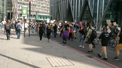TRACKING THROUGH HUGE CROWDS AT BLACK LIVES MATTER RALLY MARCHING LONDON UK, 4K Stock Footage 133203142