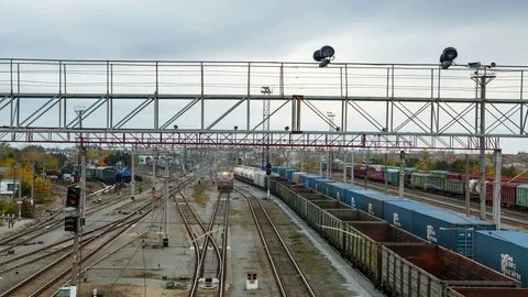 Tracking timelapse of Railway station. Moving of trains arrived at train station Stock Footage 75492590