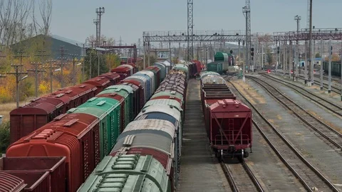 Tracking timelapse of Railway station. Moving of trains arrived at train station Video stock 75494447