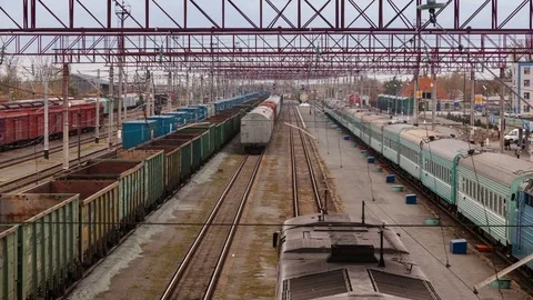 Tracking timelapse of Railway station. Moving of trains arrived at train station Stock Footage 75495805