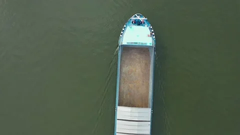 Tracking top view of inland cargo ship, sailing In the river Main in Frankfurt Stock Footage 197516133