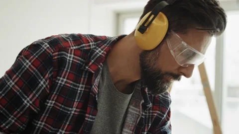 Tracking video of carpenter  using a circular saw. Stock Footage 137086774