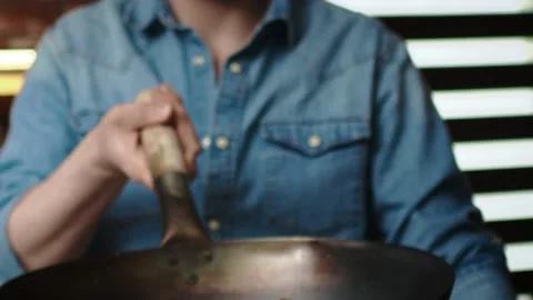 Tracking video of chef tossing the dish in the pan Stock-Footage 131588898