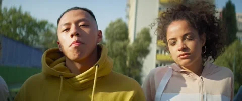 Tracking video of serious group of young people standing outdoors. Stock-Footage 150865505