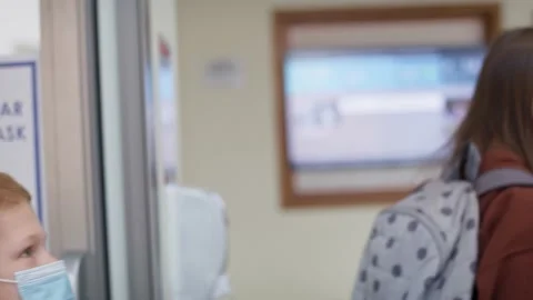 Tracking video of students during temperature control at school. Stock Footage 153608063