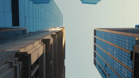 TRACKING Walking camera straight up through modern skyscraper buildings Stock Footage 97113607