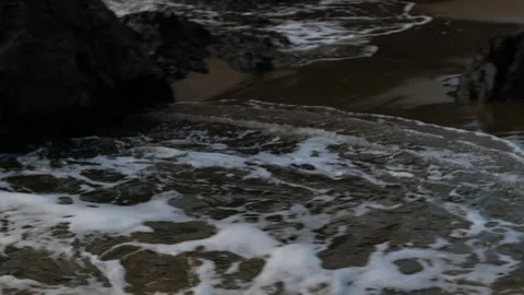 Tracking waves into a small cove Video stock 246389692