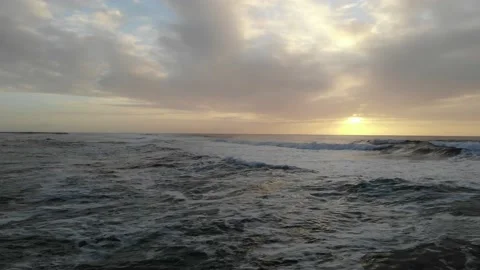 Tracking with Waves into Sunset Stock Footage