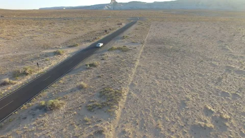Tracking white car sunset desert Stock Footage 160178665
