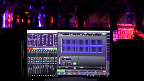 Tracking wide shot of lighting control system display in concert. Stock Footage 94473346