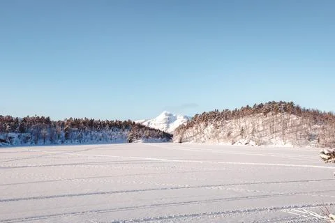Tracks create patterns across frozen lake in Balsfjord near Tromso, Norway... Fotos Stock
