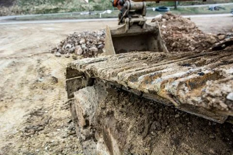 Tracks of a excavator machine on a construction site. Stock Photos