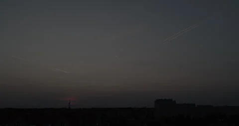 Tracks of flying planes in the sky after dusk Stock Footage 252944302