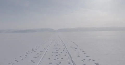 Tracks left in snow as sled moves Stock Footage 138236128