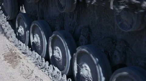 The tracks of the tank go close-up on the sand. Stock Footage 63200073