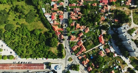 Tracktor With Empty Wagon Joining Main Road After Roundabout Still Aerial Shot Stock Footage 289418166