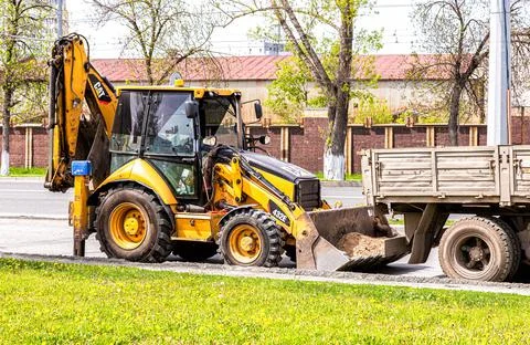 Tracror loader on the construction of new road Stock Photos