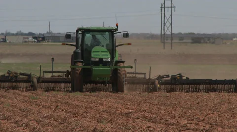 Tracter pulling 'scratcher' 1 Stock Footage 38948773