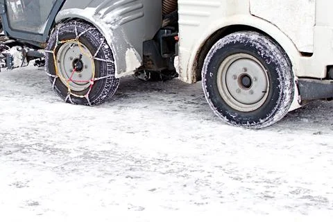 Traction chains on the wheels of a snowblower Stock Photos