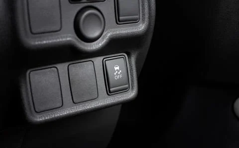 Traction control switch button and blank socket in car. Foto stock
