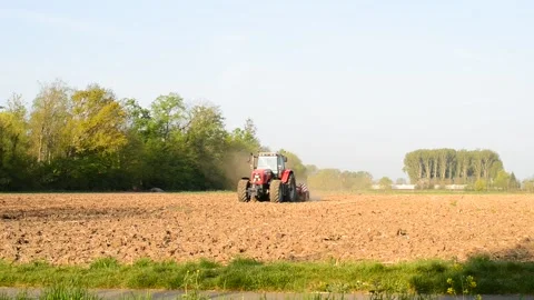Tractor aerating the soil in springtime Stock Footage 185012810