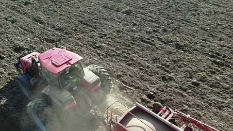 Tractor with an aggregate sowing grain crops by machine method. Stock Footage 165493437