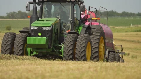 Tractor and Bailor (1) Stock Footage 221861176
