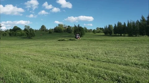 Tractor and cyclist Stock Footage 77663265