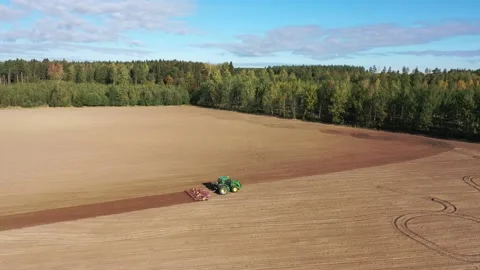 Tractor and a harrow Stock-Footage 147333646