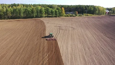 Tractor and a harrow Stock Footage 147333649