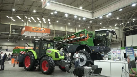 Tractor and Harvester. Agro Complex 2021. Kiev, Ukraine, the 27th of October Stock Footage 166044558