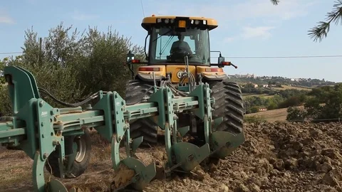 Tractor and plough Stock Footage 94543259
