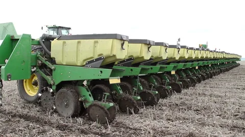 Tractor and seed drill are used to sow the sunflower 库存影片 62403094