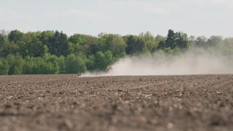 A tractor and a seeder are sowing a field. wheat. Ukraine Stock Footage 242596391