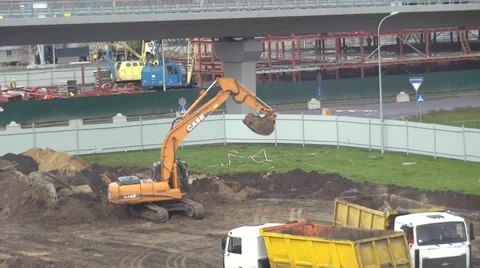 Tractor and trucks at construction area Stock Footage 33376542