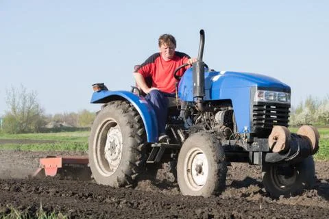 Tractor with attached cutter Stock Photos