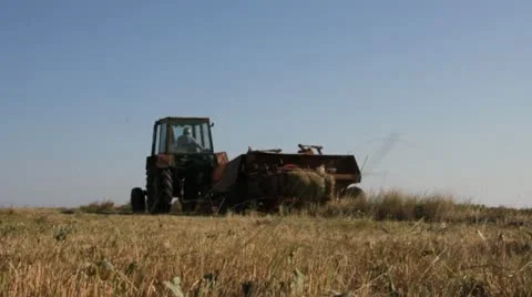 Tractor baler machine in the field of Ukraine Stock Footage 18195058