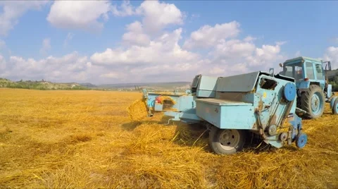Tractor Baler Making Fresh Bale During Harvesting Stock-Footage 53827655