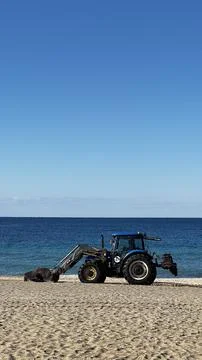 Tractor beach ocean Stock Photos