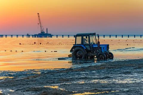 Tractor on the beach Stock Photos