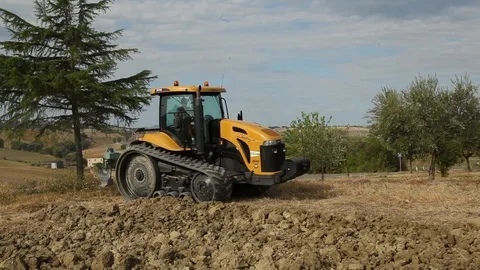 Tractor begins ploughing Stock Footage 94543544